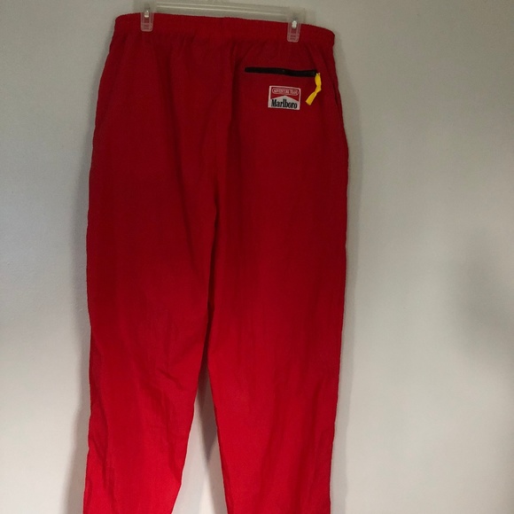 red nylon track pants